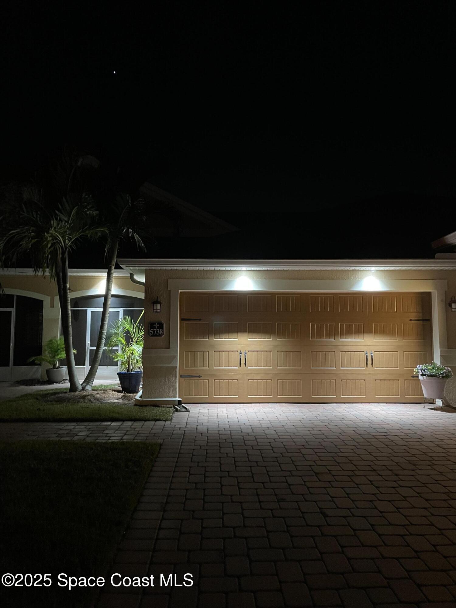 5738 Tamarac Drive Melbourne, FL 32940 - Photo 27 of 27 a front view of a house with a yard