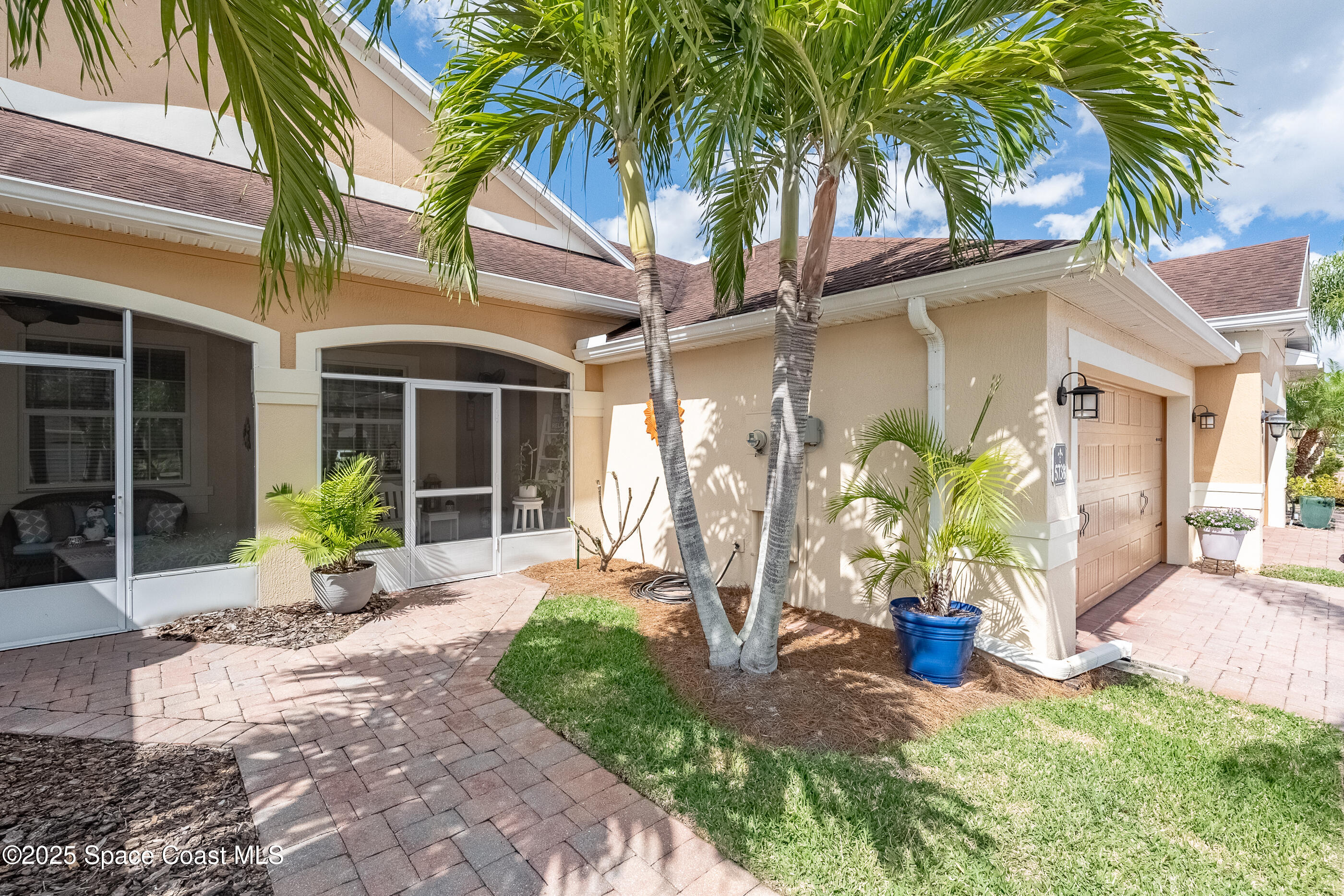 5738 Tamarac Drive Melbourne, FL 32940 - Photo 4 of 27 a view of a house with porch and garden