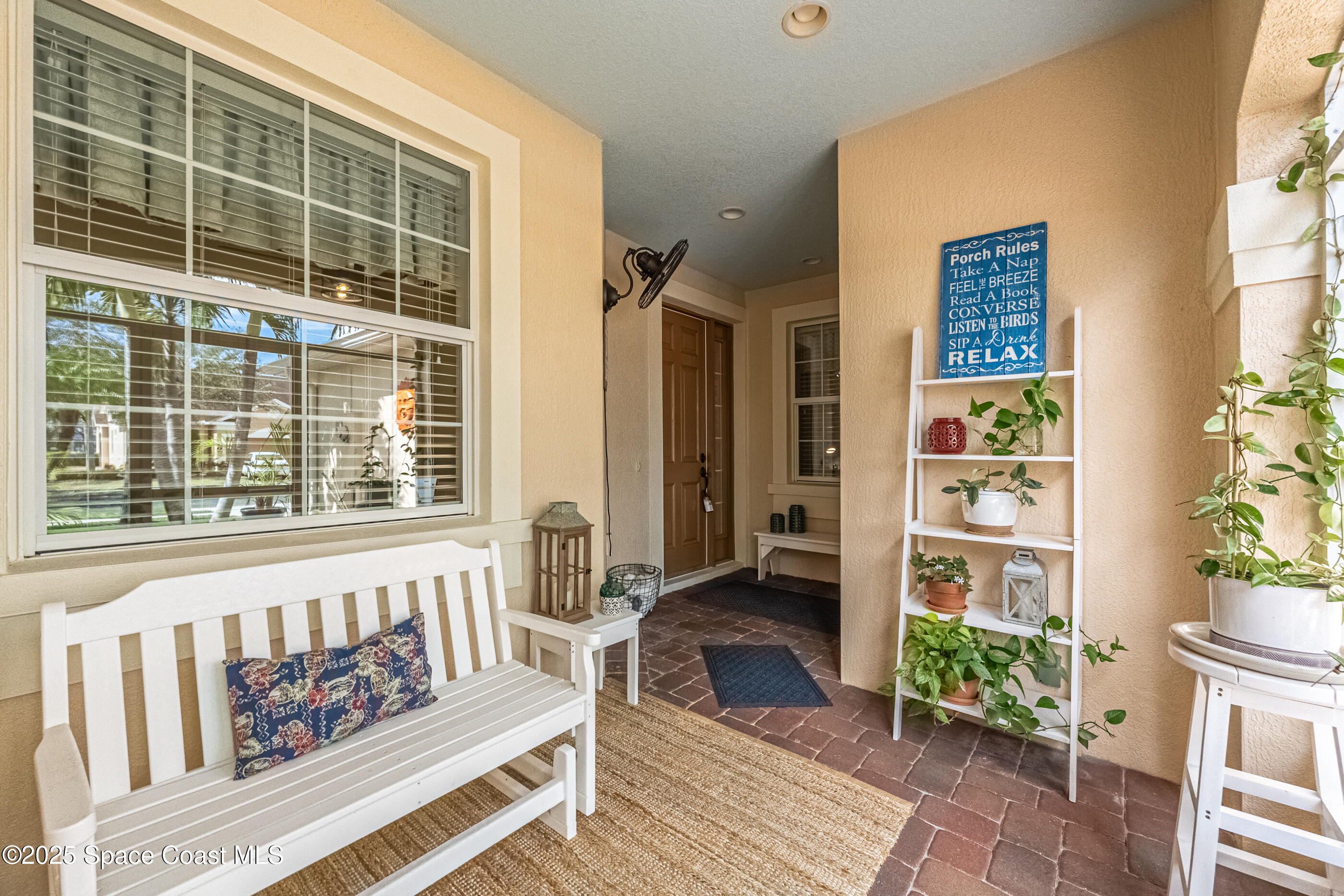 5738 Tamarac Drive Melbourne, FL 32940 - Photo 5 of 27 a front view of a house with outdoor seating