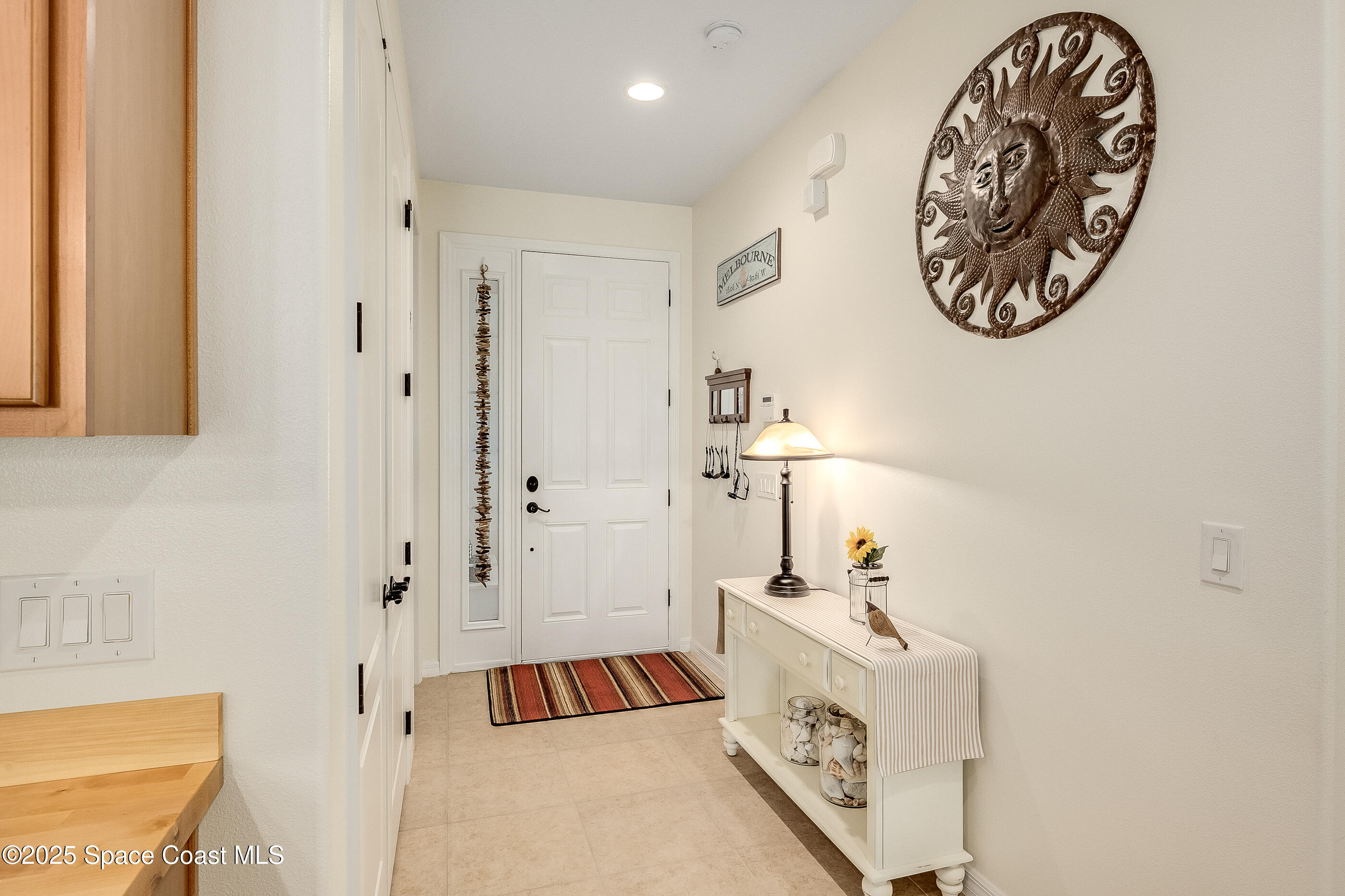 5738 Tamarac Drive Melbourne, FL 32940 - Photo 6 of 27 a bathroom with a sink and a mirror