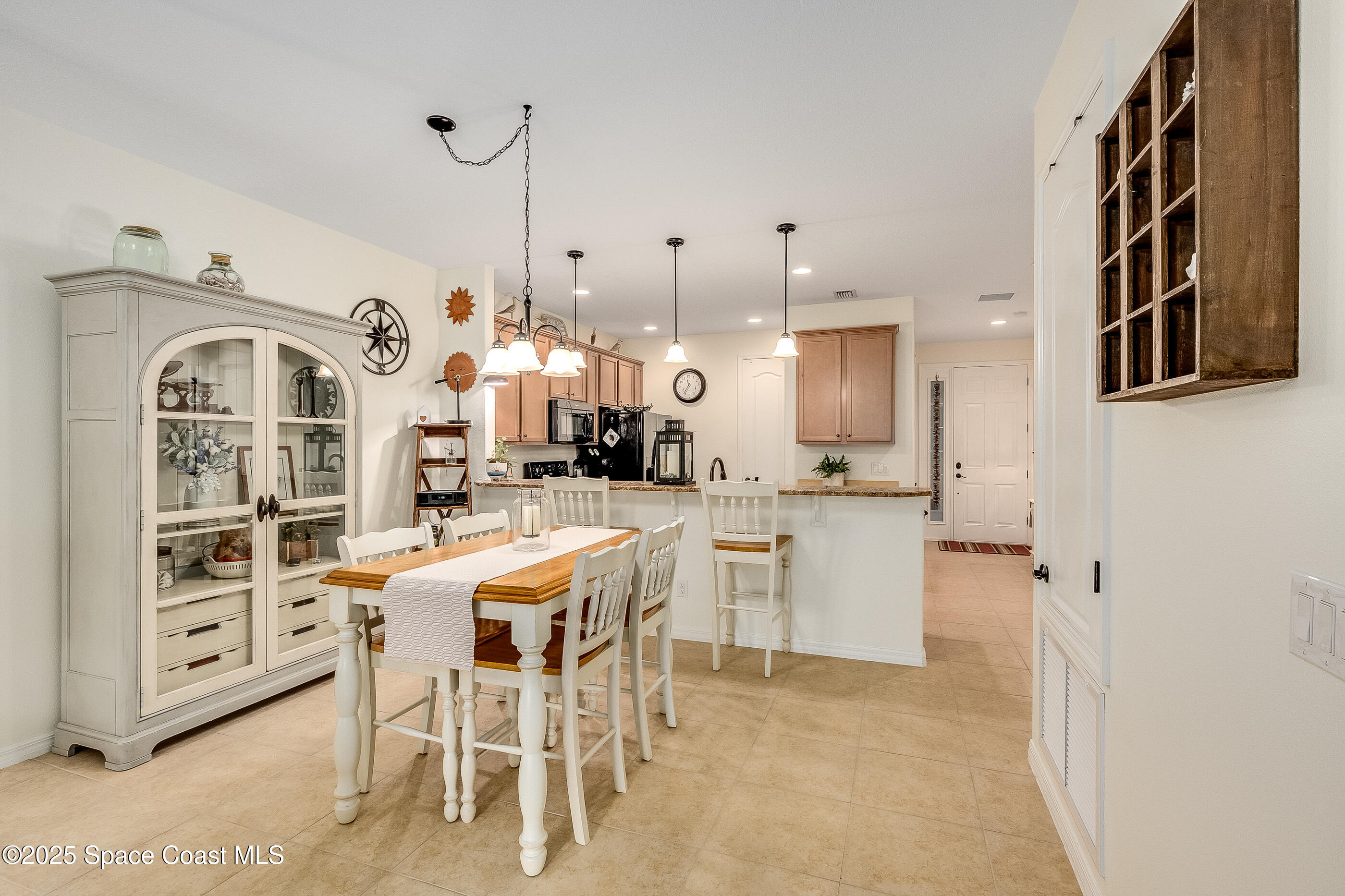 5738 Tamarac Drive Melbourne, FL 32940 - Photo 10 of 27 a view of a kitchen and dining room
