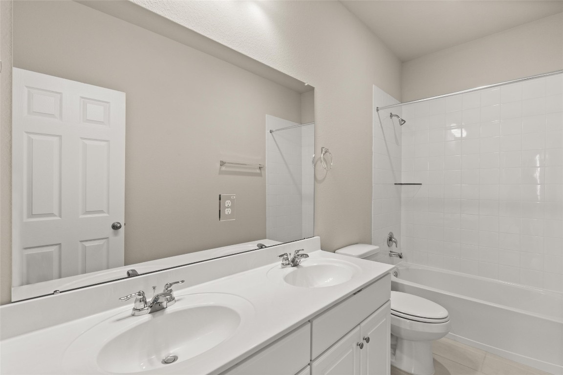 313 Redbud Rdg Drive Brookshire, TX 77423 - Photo 22 of 32 a bathroom with a sink a toilet and shower