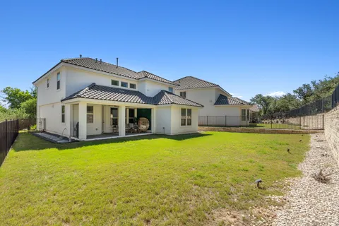a front view of house with swimming pool having outdoor seating