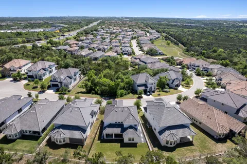 an aerial view of a house with a lake view