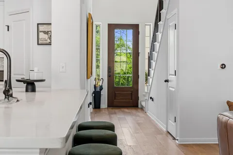 a bathroom with a tub sink and a mirror
