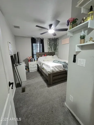 a bed room with a bed and a window