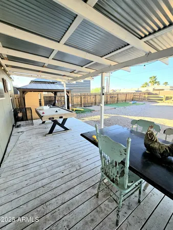a sitting area with view of swimming pool