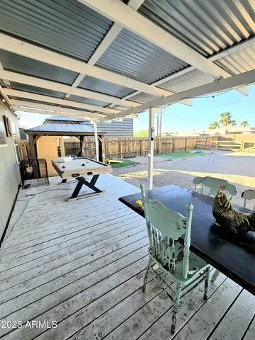a sitting area with view of swimming pool
