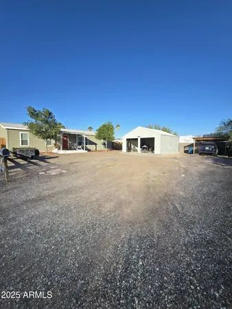a view of an outdoor space and basketball court