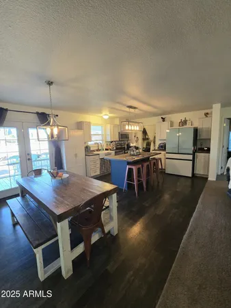 a dining table with chairs and window