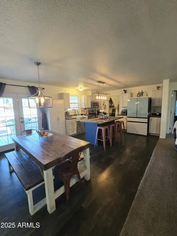 a dining table with chairs and window