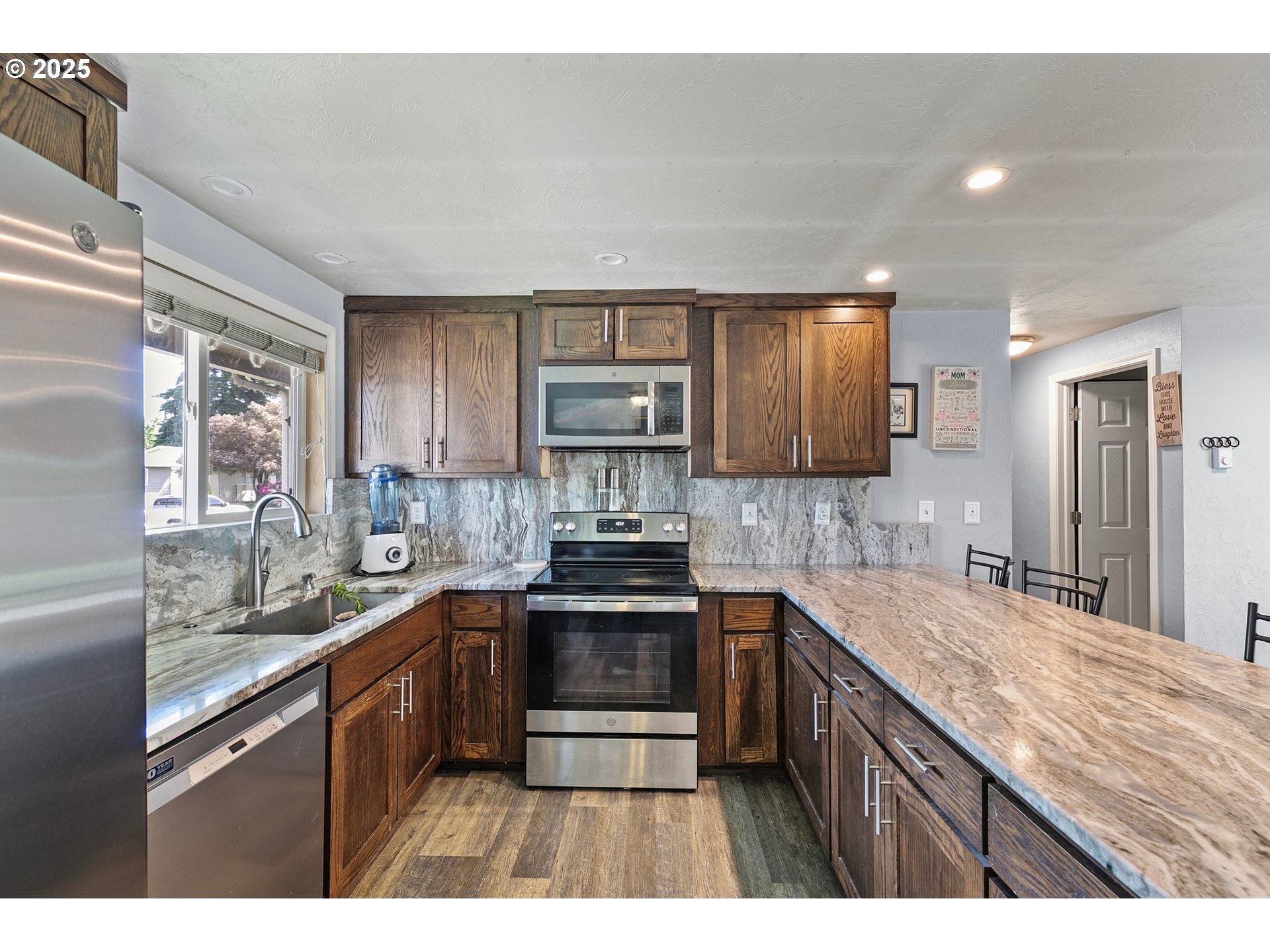 1221 Kenray Loop Springfield, OR 97477 - Photo 10 of 19 a kitchen with a sink stove and cabinets