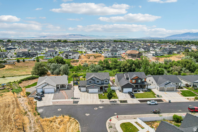 203 North 1900th Street West Mapleton, UT 84664 - Photo 47 of 48 Aerial perspective showcasing a residential neighborhood with diverse architectural styles and extensive green spaces