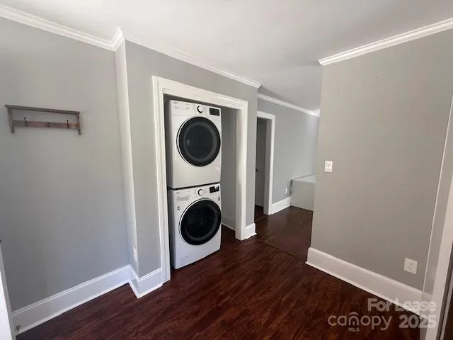 a view of a hallway with washer and dryer