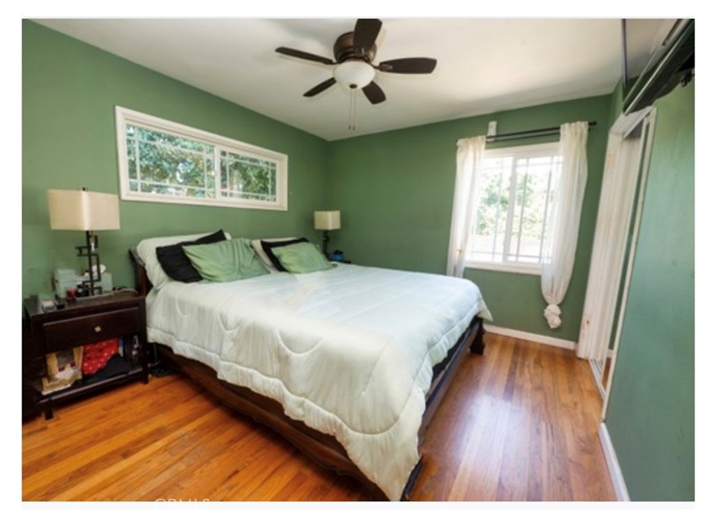 832 Frankel Avenue Montebello, CA 90640 - Photo 5 of 11 a bedroom with a bed and a chandelier