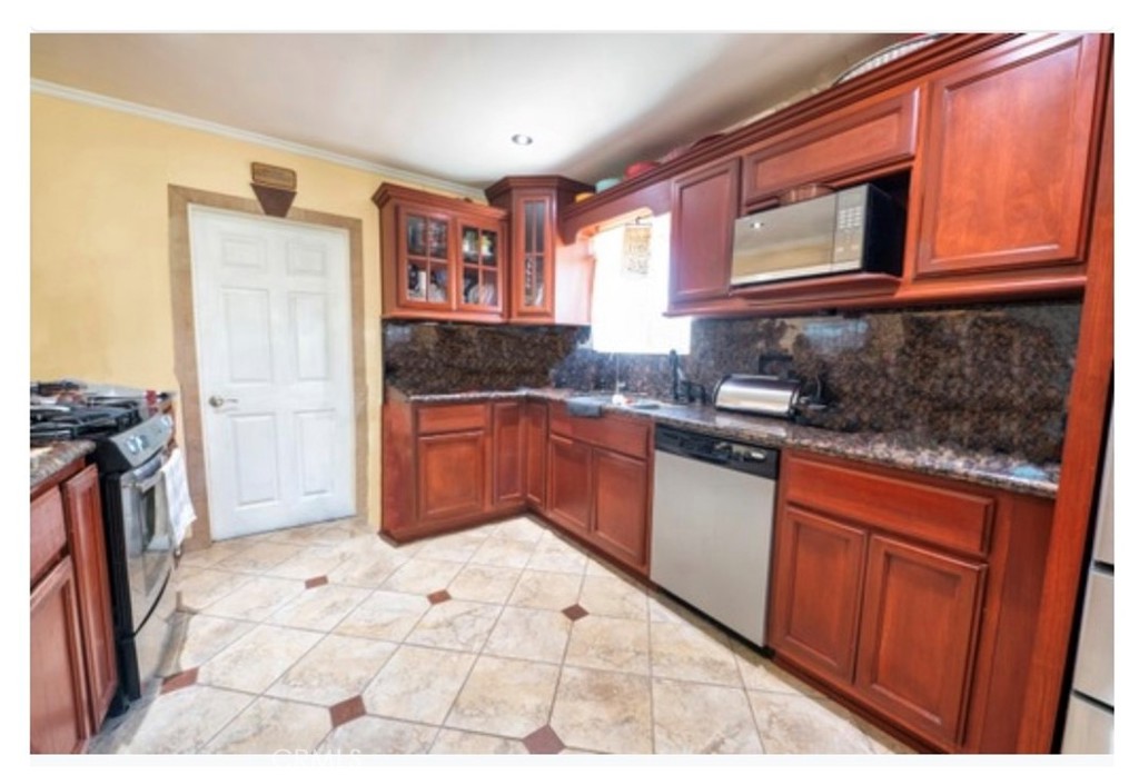 832 Frankel Avenue Montebello, CA 90640 - Photo 8 of 11 a kitchen with granite countertop a sink stove and refrigerator