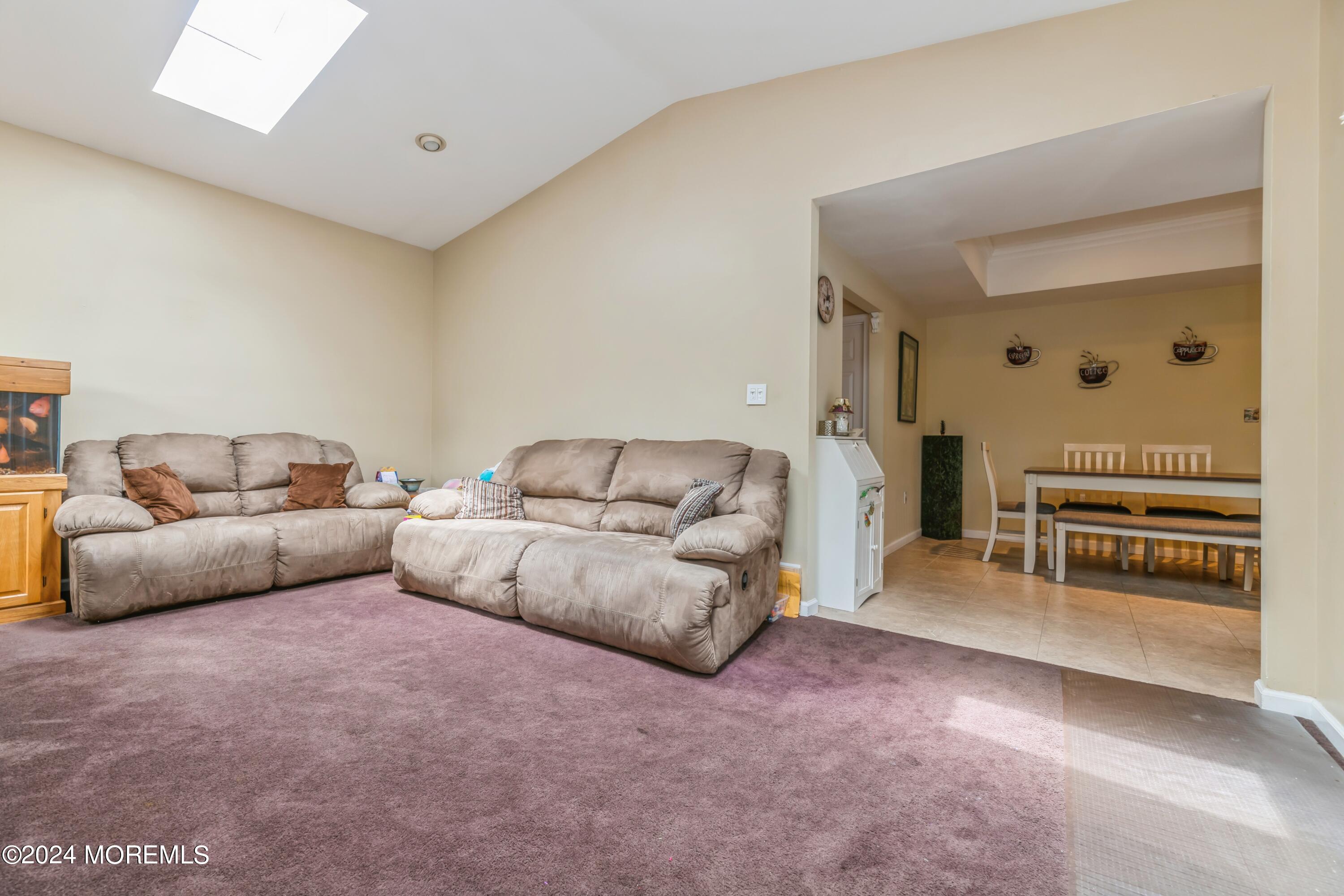 95 Nutmeg Road Aberdeen, NJ 07747 - Photo 13 of 21 a living room with furniture and a flat screen tv