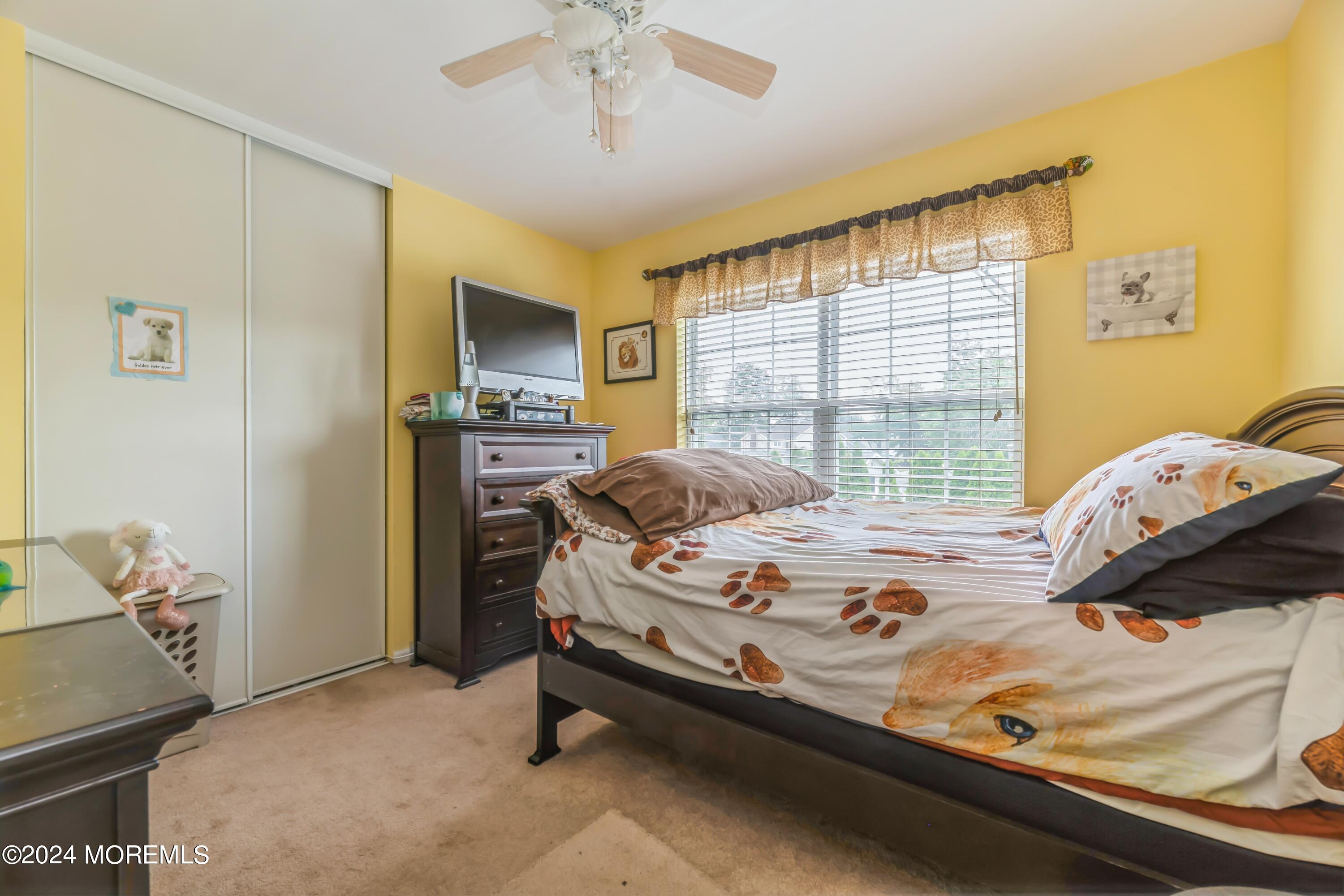 95 Nutmeg Road Aberdeen, NJ 07747 - Photo 14 of 21 a bed sitting in a bedroom next to a window