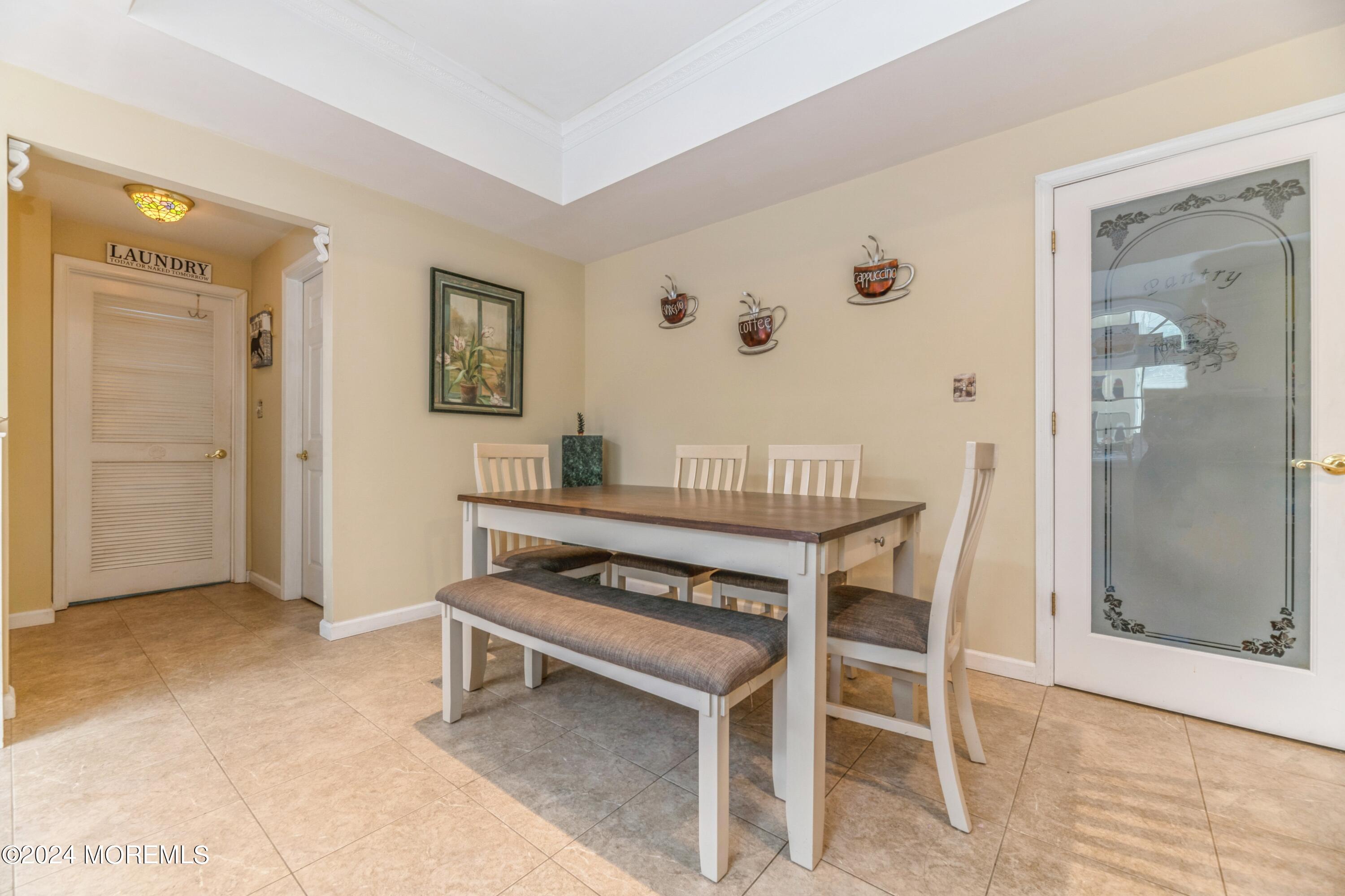 95 Nutmeg Road Aberdeen, NJ 07747 - Photo 9 of 21 a view of kitchen with furniture and wooden floor