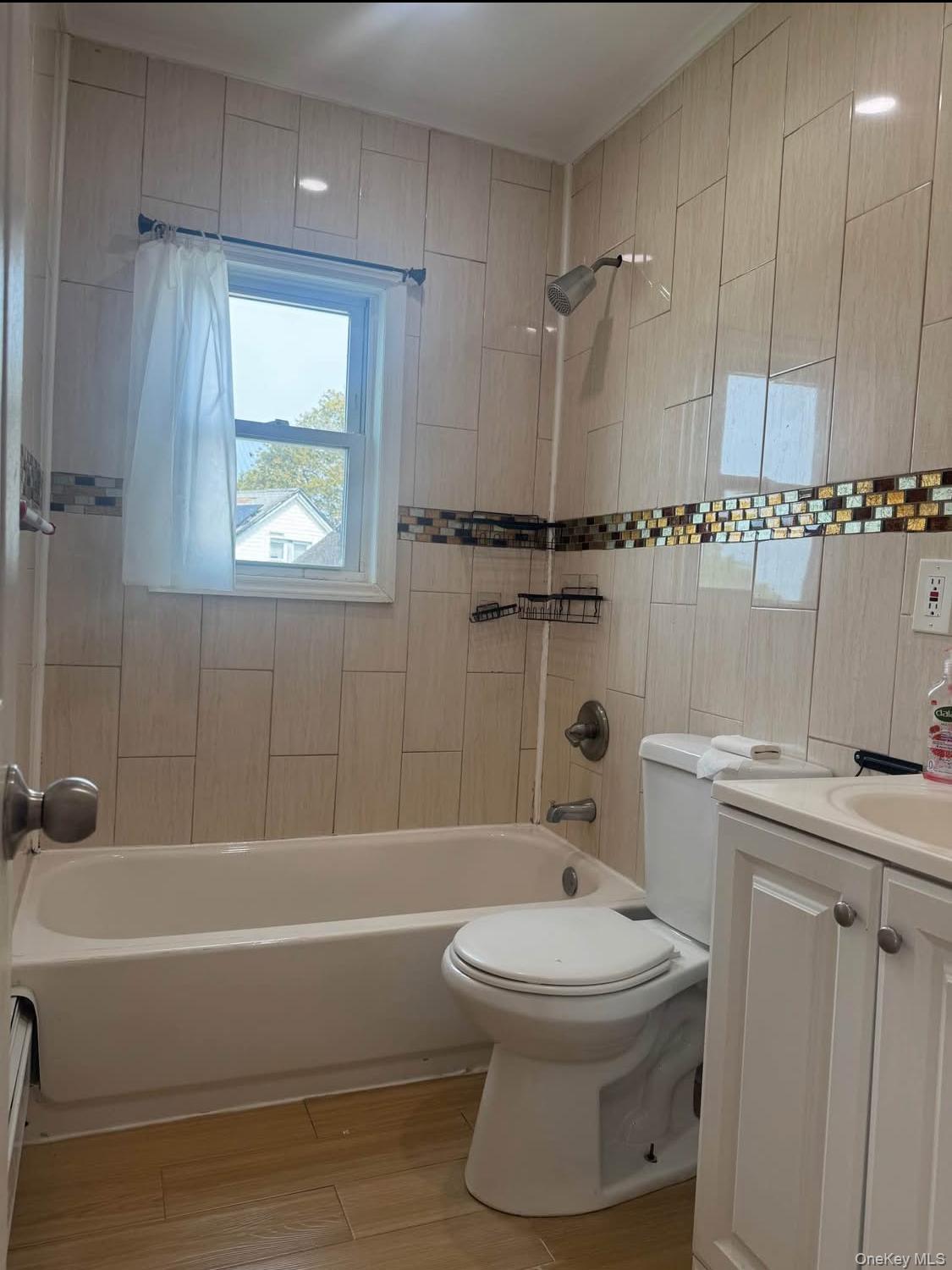 110-15 Rockaway Boulevard Queens, NY 11420 - Photo 10 of 10 a bathroom with a toilet a sink and bathtub