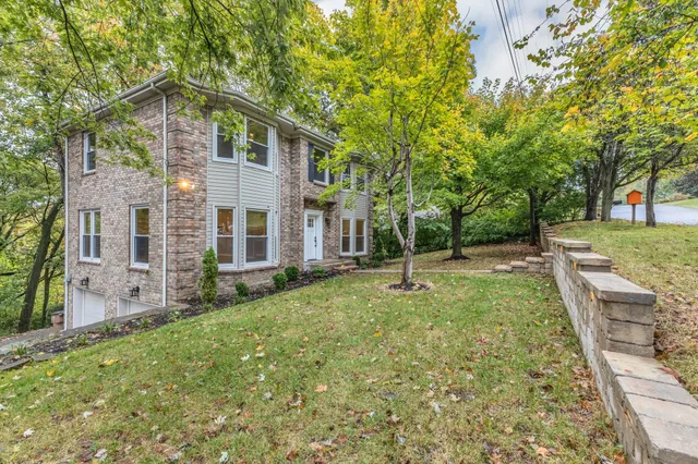 a backyard of a house with barbeque oven