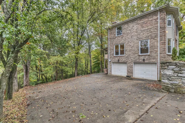 a view of a house with a tree