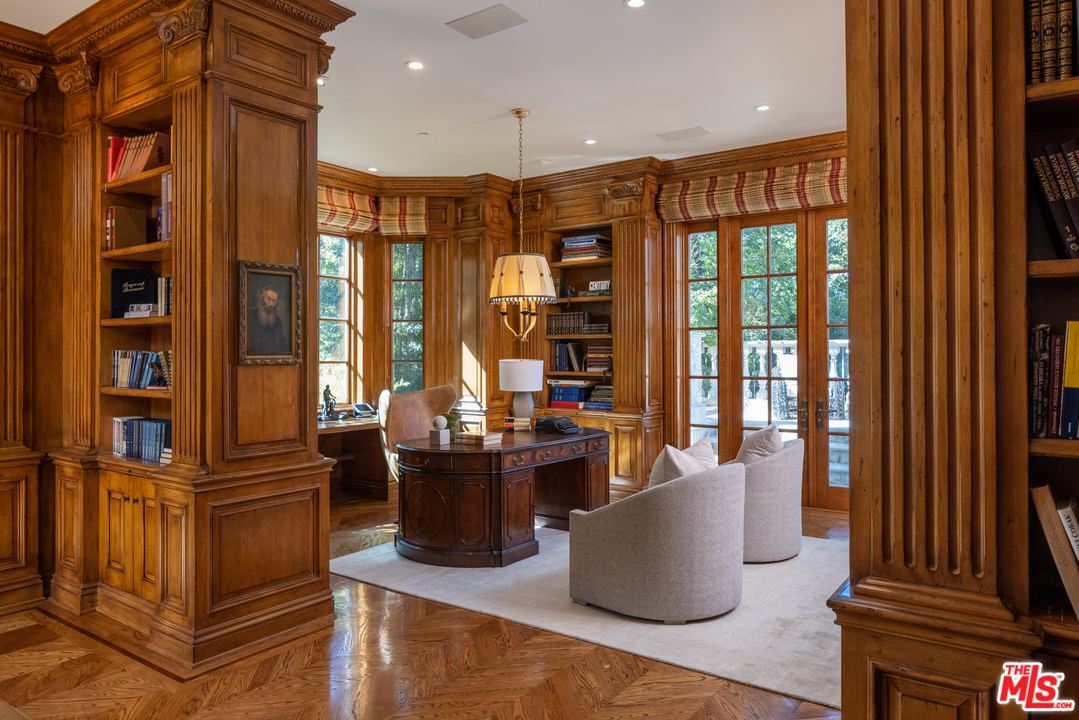 10 Beverly Park Beverly Hills, CA 90210 - Photo 11 of 33 a kitchen with stainless steel appliances granite countertop a stove and a refrigerator