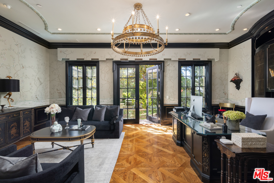 10 Beverly Park Beverly Hills, CA 90210 - Photo 12 of 33 a living room with furniture and a chandelier