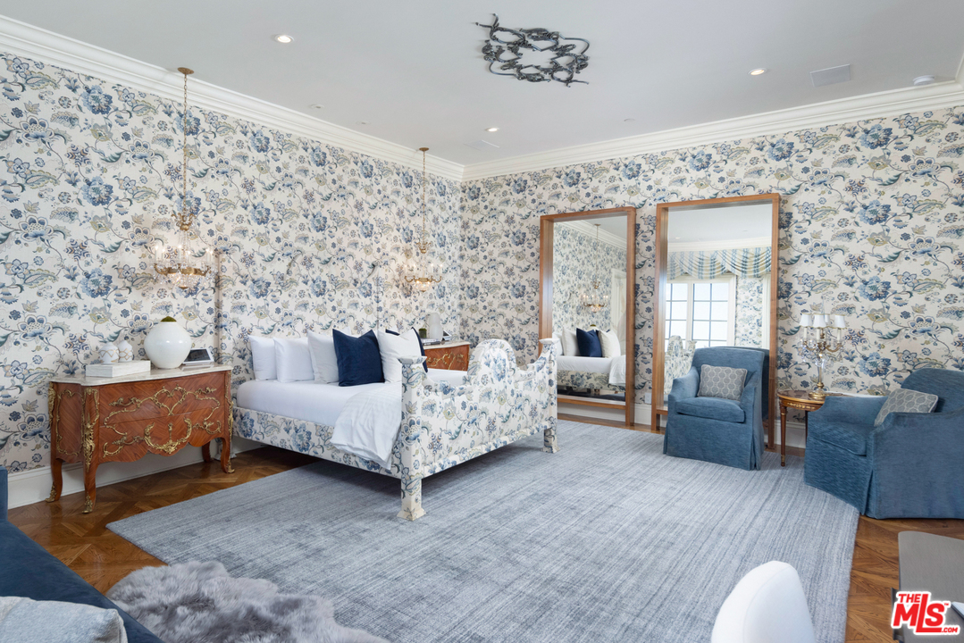 10 Beverly Park Beverly Hills, CA 90210 - Photo 16 of 33 a spacious bedroom with a bed and a couch