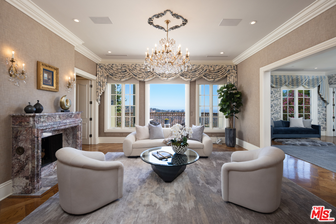 10 Beverly Park Beverly Hills, CA 90210 - Photo 17 of 33 a living room with furniture or chandelier and a fireplace
