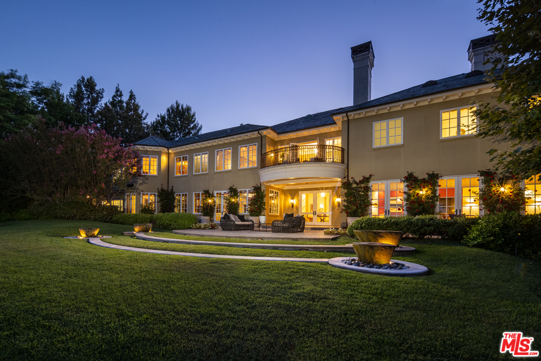 10 Beverly Park Beverly Hills, CA 90210 - Photo 3 of 33 a front view of a building with play ground and trees