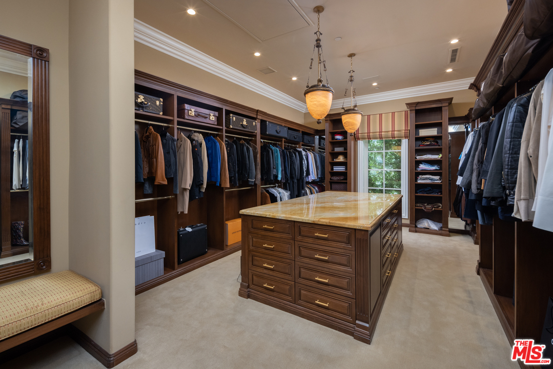 10 Beverly Park Beverly Hills, CA 90210 - Photo 21 of 33 a room with a bed and a walk in closet