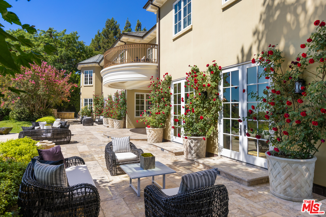 10 Beverly Park Beverly Hills, CA 90210 - Photo 26 of 33 a view of a patio with couches and potted plants