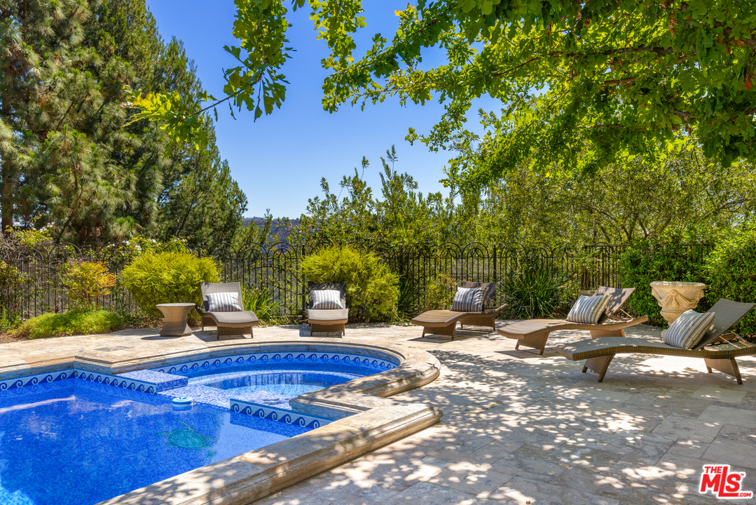 10 Beverly Park Beverly Hills, CA 90210 - Photo 28 of 33 a view of a backyard with swimming pool