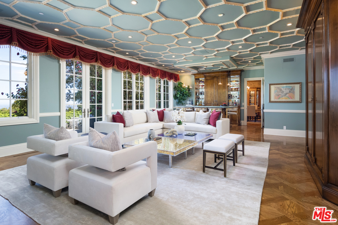 10 Beverly Park Beverly Hills, CA 90210 - Photo 8 of 33 a living room with furniture and a chandelier