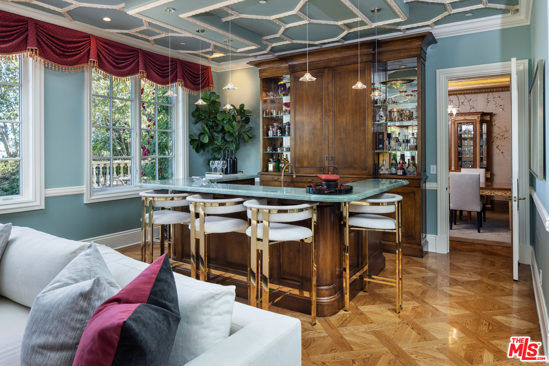 10 Beverly Park Beverly Hills, CA 90210 - Photo 9 of 33 a living room with furniture and a floor to ceiling window