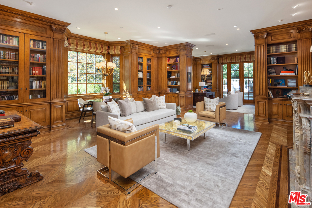 10 Beverly Park Beverly Hills, CA 90210 - Photo 10 of 33 a living room with fireplace furniture and large windows