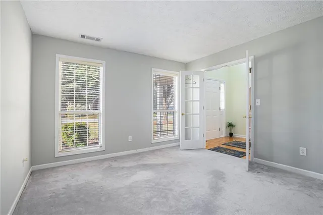 a view of an empty room with a window
