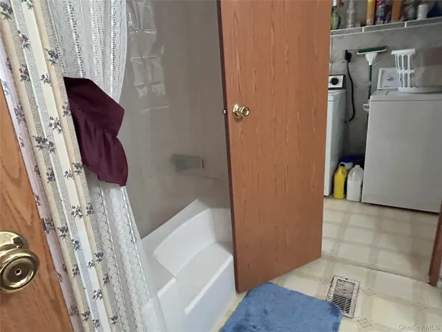 a bedroom with a bed and a mirror