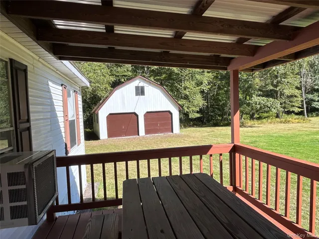 a view of a swimming pool with an outdoor space and seating area