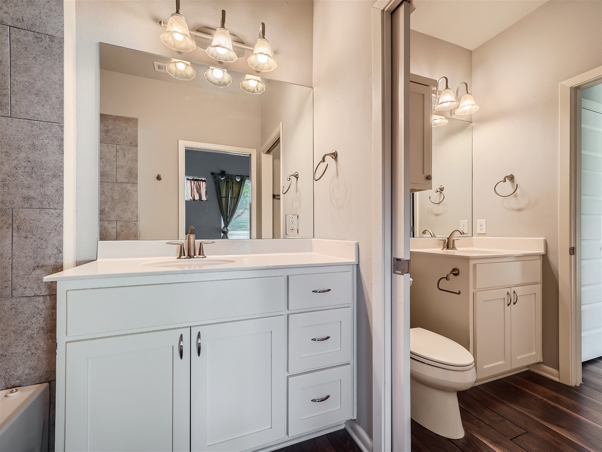 507 Venture Boulevard South Point Venture, TX 78645 - Photo 13 of 31 a bathroom with a toilet sink and mirror