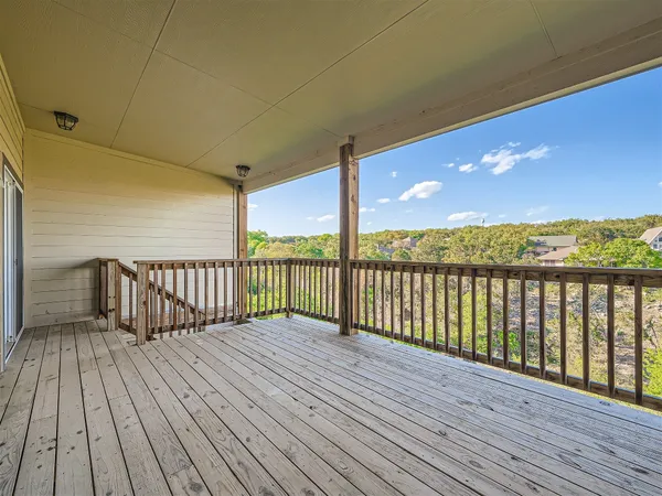 a view of balcony with wooden floor