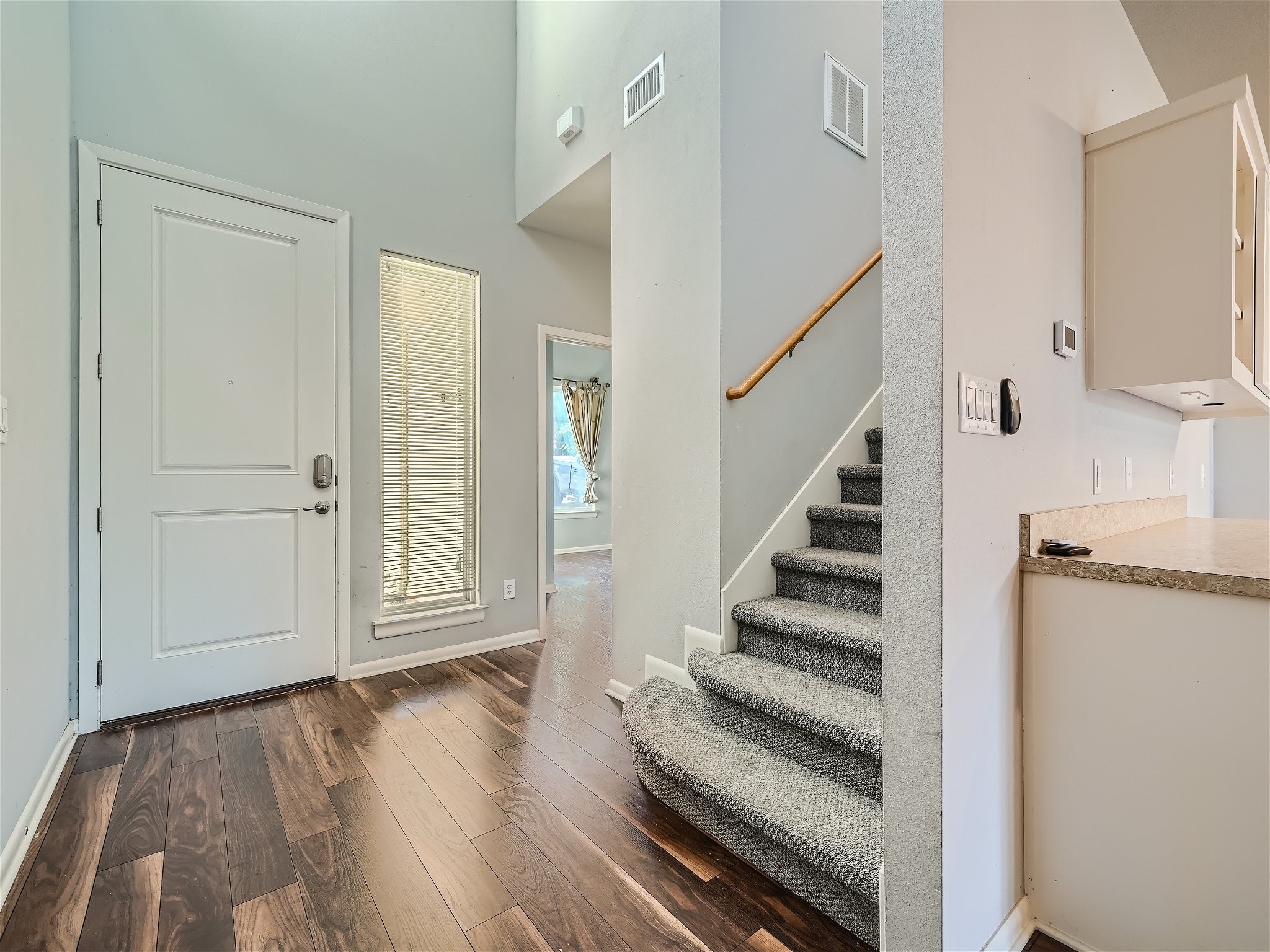 507 Venture Boulevard South Point Venture, TX 78645 - Photo 25 of 31 a view of entryway with wooden floor and staircase