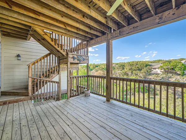 a view of a balcony with wooden floor