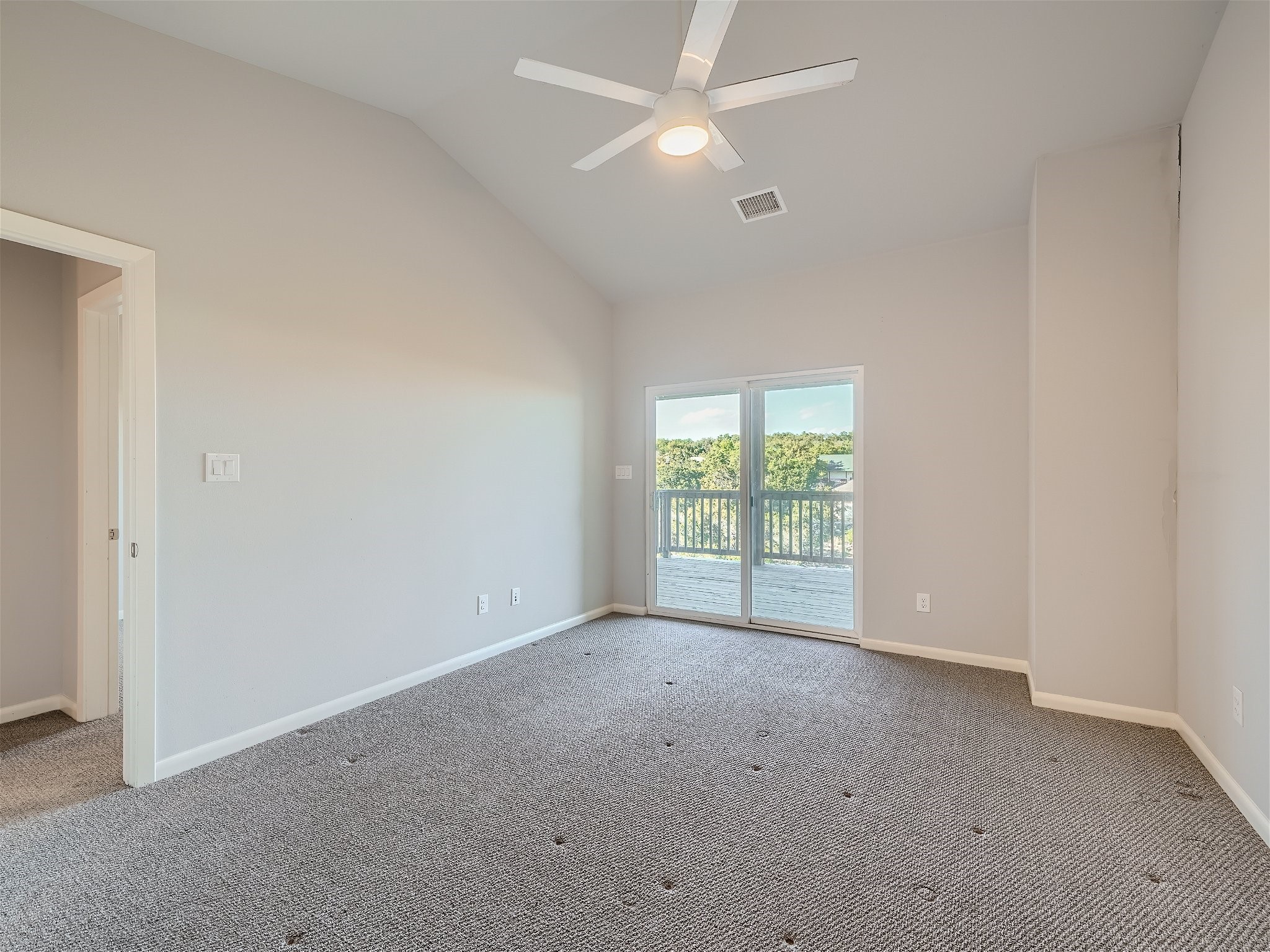 507 Venture Boulevard South Point Venture, TX 78645 - Photo 8 of 31 an empty room with a fan & a window