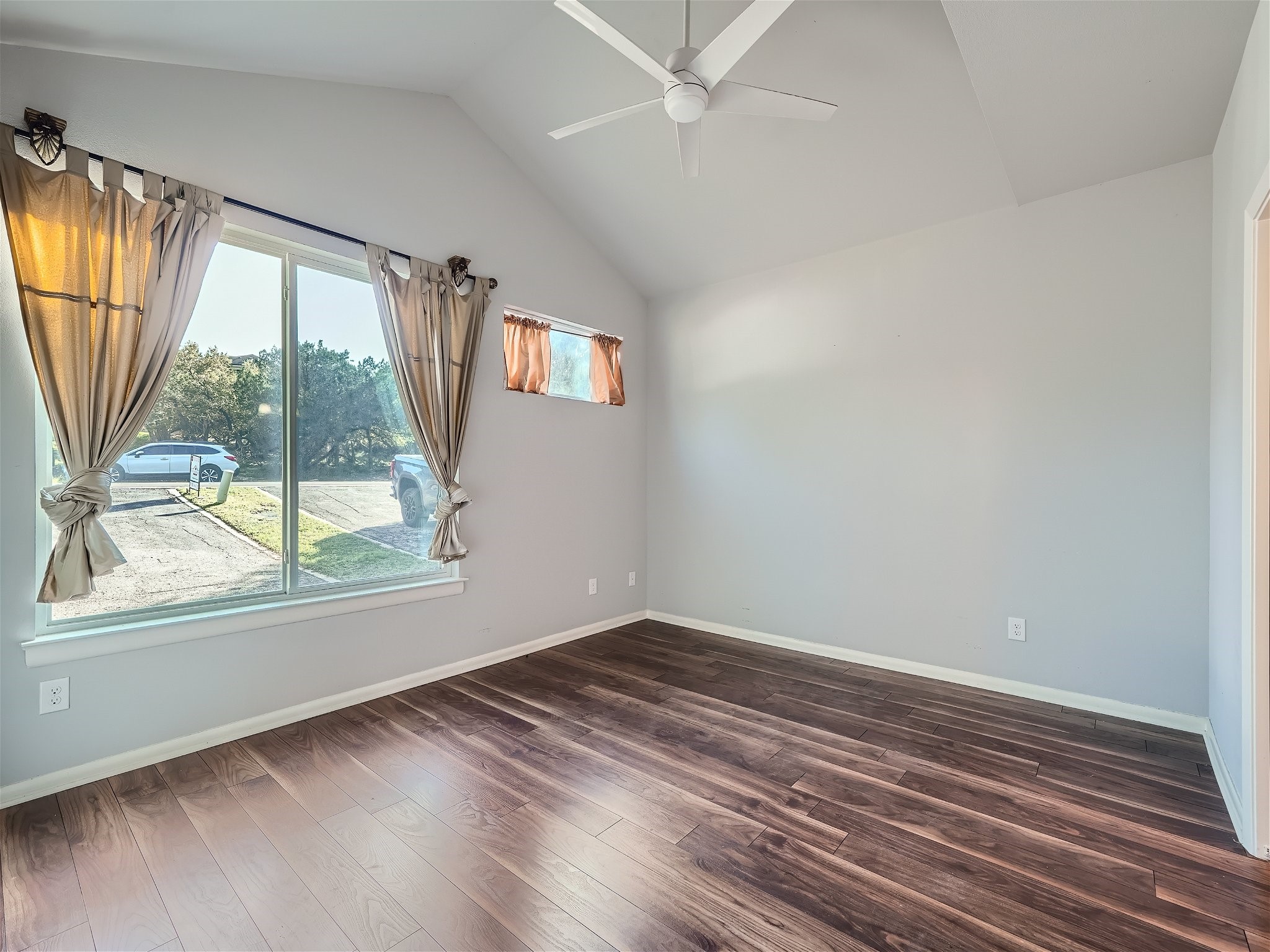 507 Venture Boulevard South Point Venture, TX 78645 - Photo 9 of 31 wooden floor in an empty room with a window