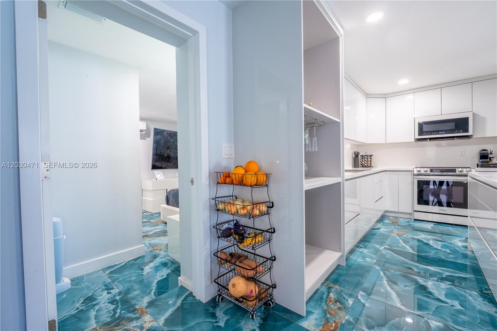 11851 Southwest 181st Street Miami, FL 33177 - Photo 10 of 25 a kitchen with stainless steel appliances granite countertop a refrigerator and a sink