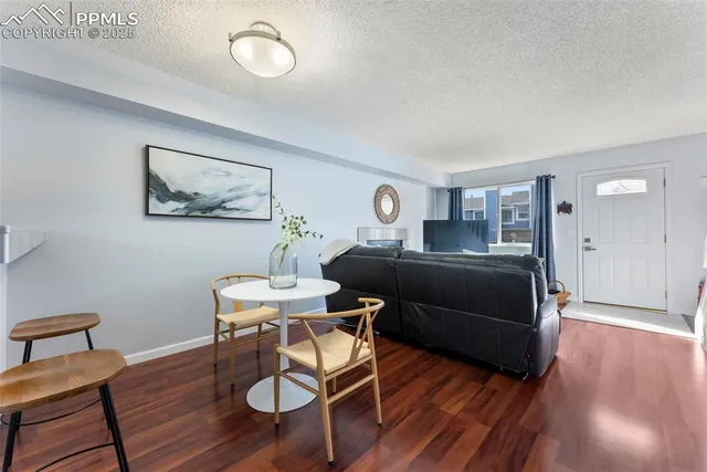 a bedroom with furniture and a wooden floor