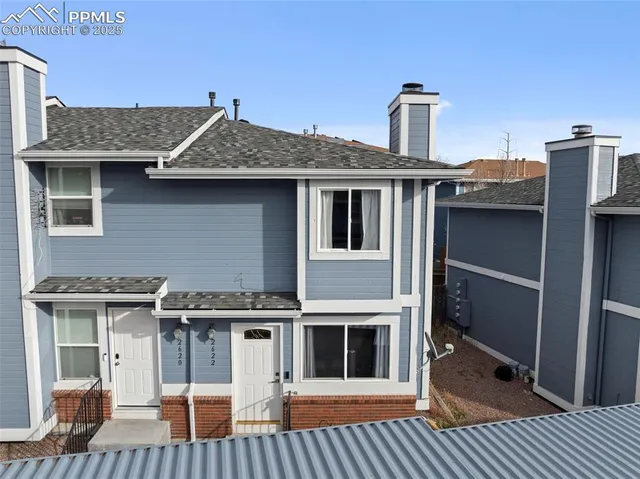 a front view of a house with glass windows