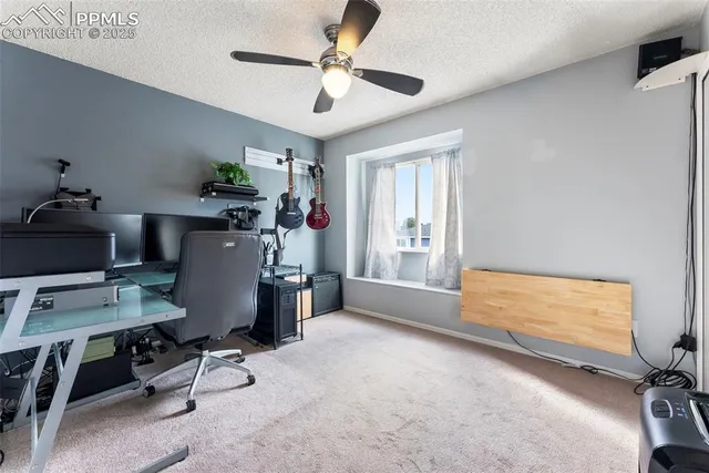 a workspace with furniture and window